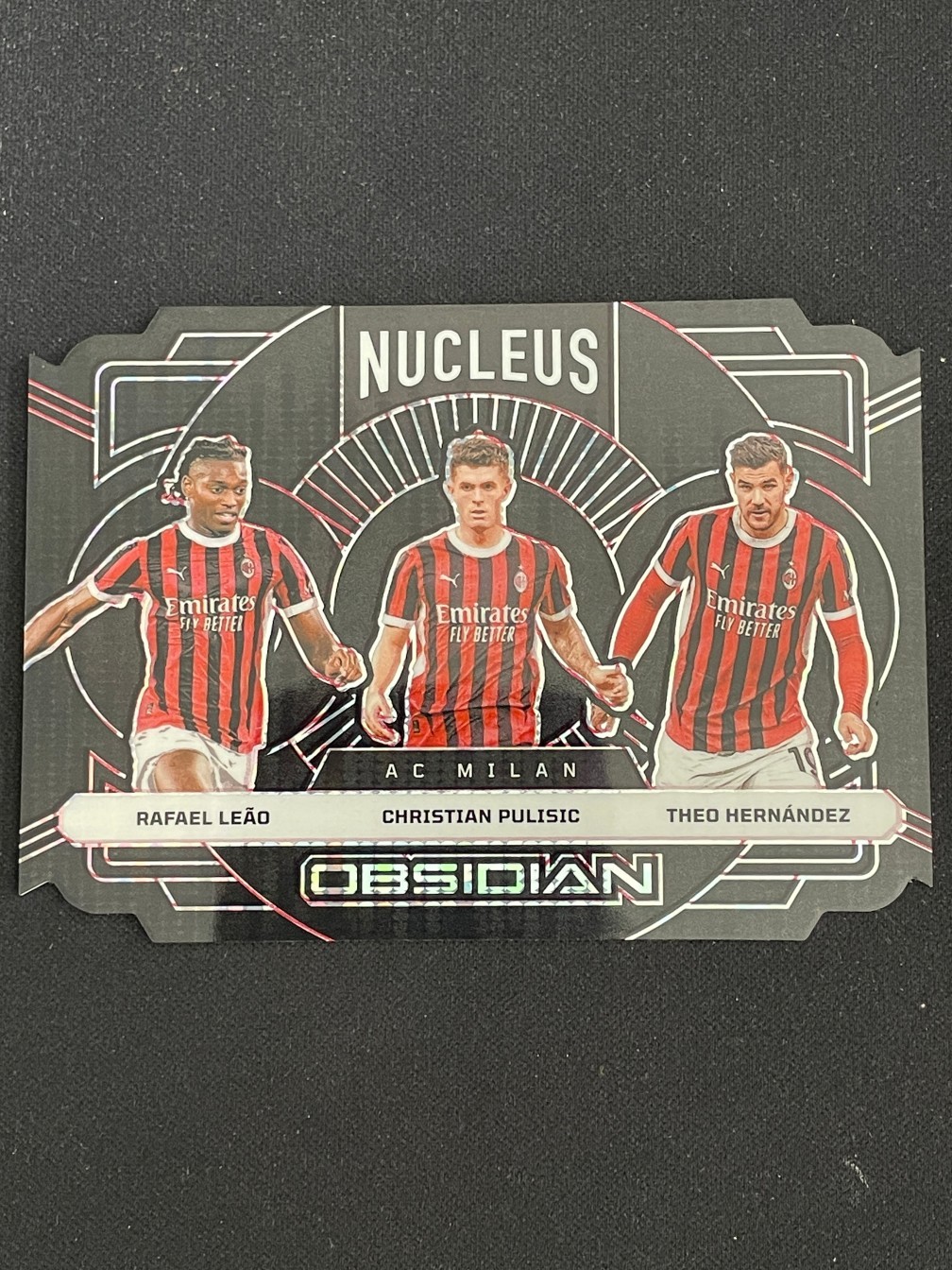 Rafael Leao/Christian Pulisic/Theo Hernandez 2024-25 Obsidian Nucleus 30/50 #1