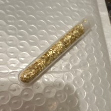 Vial of gold flakes