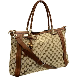 Accessoires magasin Izumi Gucci 269946 213317 GG toile 2w
