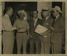 1953 Press Photo Peter Lococo Co. employees answer questions after a robbery