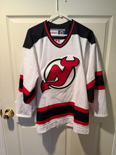 CCM New Jersey Devils Jersey Unisex Adulto Medio Bianco Nero NHL Hockey Vintage - Foto 1 di 3