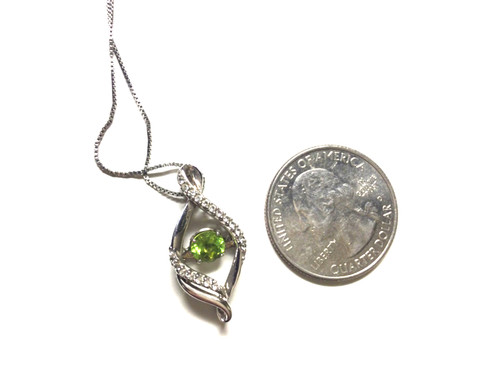 Zales Jewelers 4.5mm Floating Peridot Infinity Pendant in Sterling