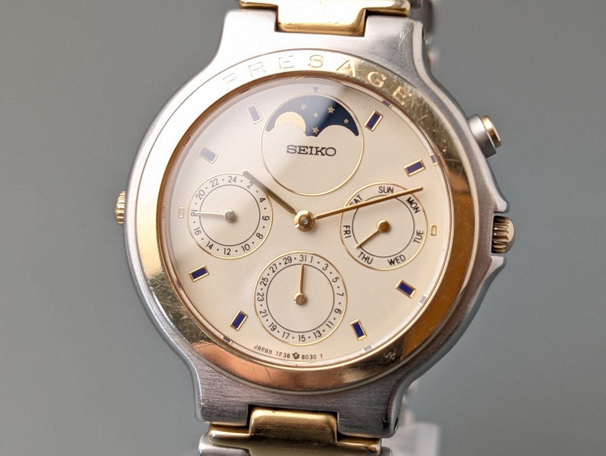 1987 Seiko SQ100 Moon Phase 7F38-6110 White Dial Round
