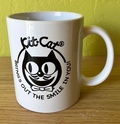 KIT-CAT KLOCK Logo Ceramic Coffee Mug "Brings Out The Smile In You" Kat Clock - Picture 1 of 3