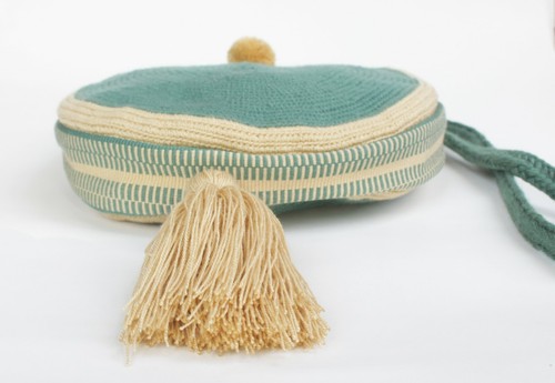 Round crossbody bag with tassel & pom pom | thin strap | green and beige - Picture 2 of 3