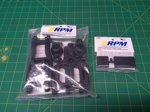 Tmaxx black RPM 80942 True-Track rear arm conversion with 80152 braces Emaxx too
