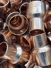  100 1-1/2" X 1"  1-5/8 X 1-1/8 OD COPPER REDUCING COUPLING W/ STOP C X C 