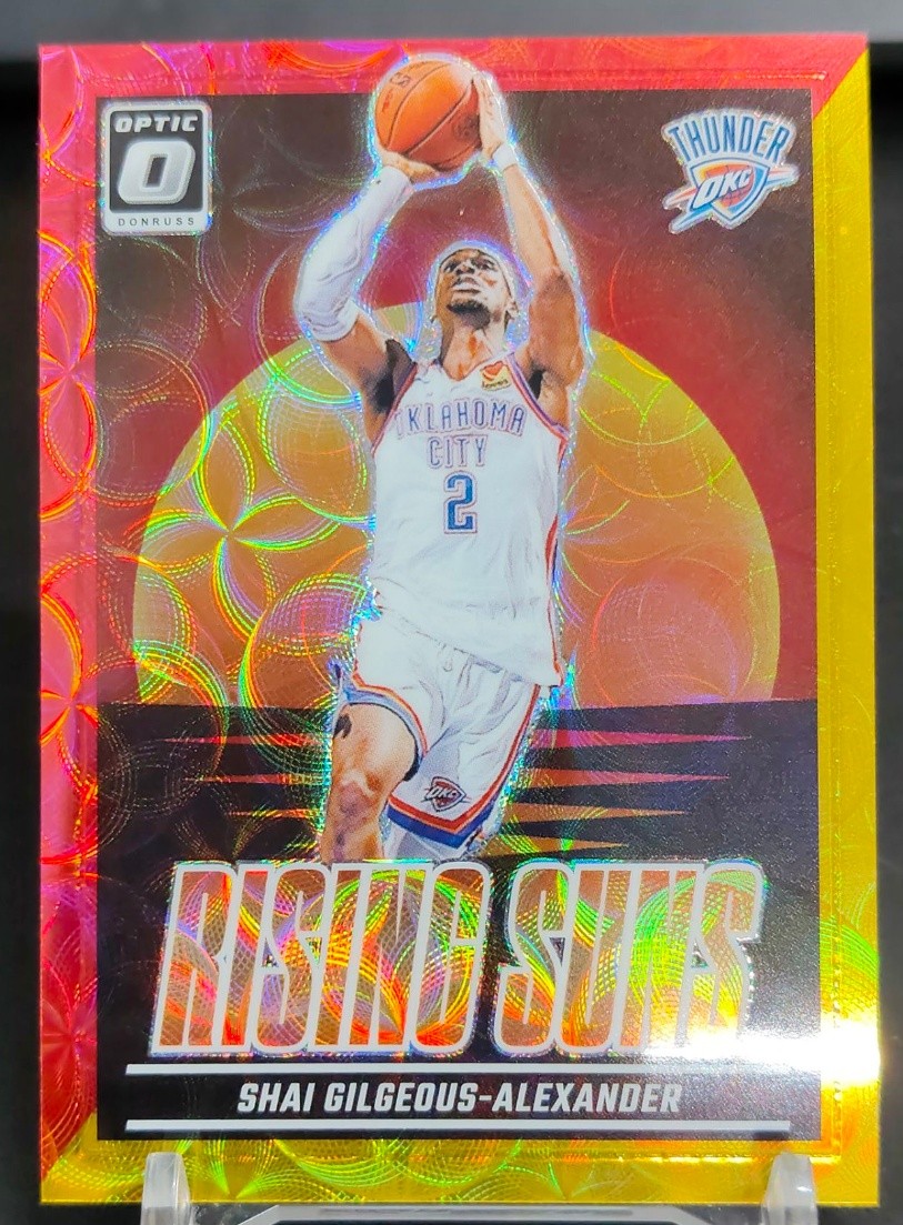 Shai Gilgeous-Alexander 2024-25 Donruss Optic Rising Suns Red Gold Choice /99