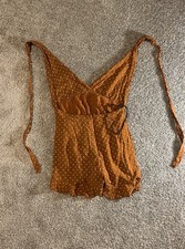 Women  s Forever 21 Rusty Orange Polkadotted Romper Size large Open back