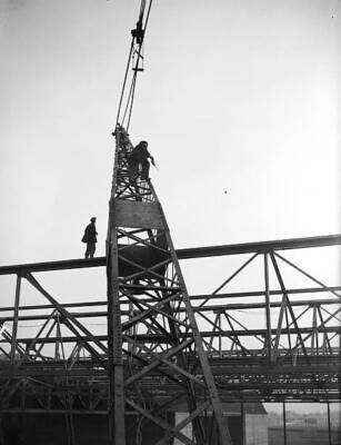 Worker goes aloft to oil the pulley wheel of a crane towerin - 1936 Old Photo 1