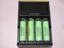 Genuine Nitecore D4 Digi charger w/ 4 Panasonic Flashlight NCR B batteries w/PCB