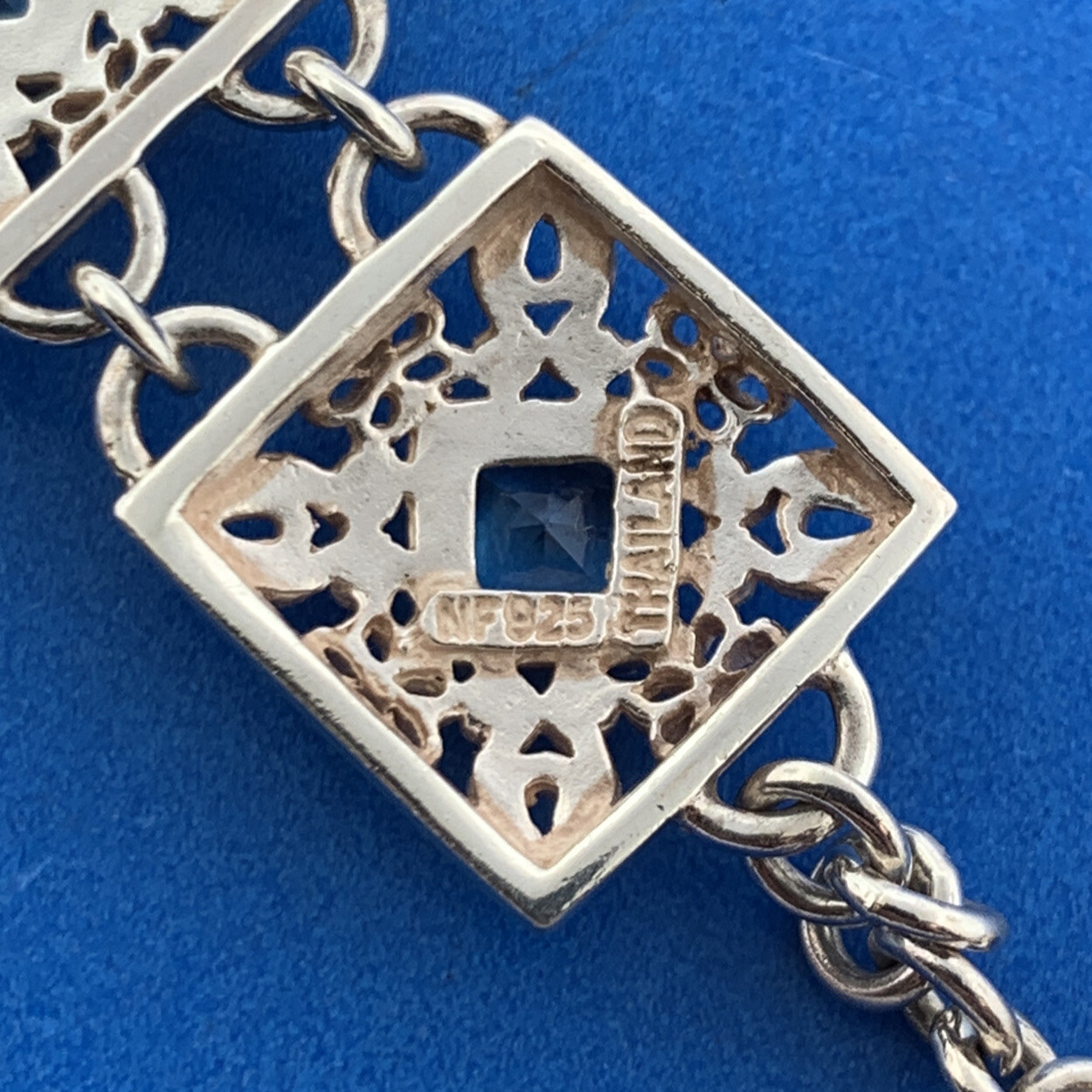 Designer NF Sterling Silver Square Blue Topaz Open Scroll Toggle Tennis