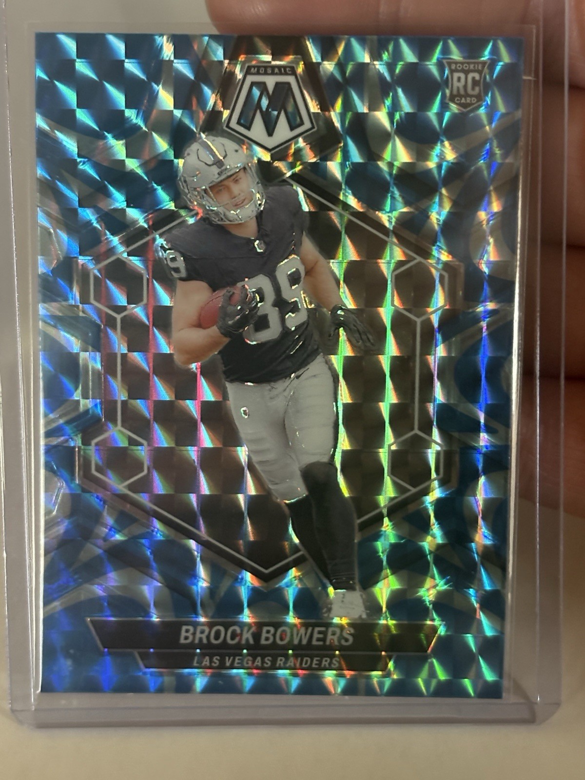 2024 Panini Mosaic Rookies Brock Bowers #313 Reactive Blue Mosaic Prizm (RC)