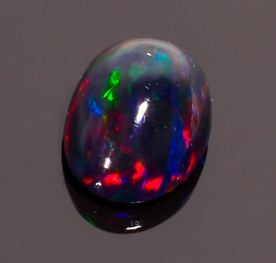 Piedra preciosa suelta cabujón forma ovalada ópalo etíope negro natural 2,5 quilates 11x8x5 mm Foto 3 de 3