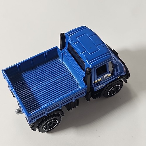 Matchbox Mercedes-Benz Unimog U300 2006 Blue Byrd Farms 1:64 camion pressofuso - Foto 9 di 13