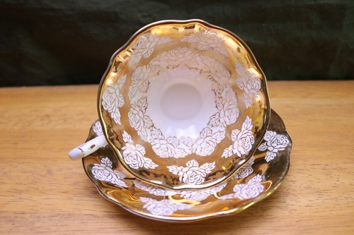 Taza de té y platillo Queen Anne 22 oro rosa patas Inglaterra hueso vintage - Imagen 1 de 11