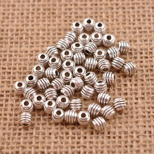 100 piezas dijes redondos de plata tibetana espaciador hallazgos de joyería 5*4,5 mm A3042 - Imagen 4 de 7