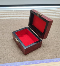 Shiny red painted wooden trinket box with hinged lid