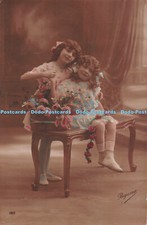 R252941 Two girls with ribbon in hair Chair Regina A Christensen