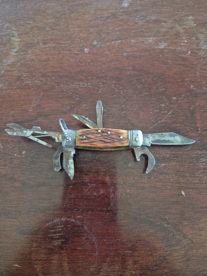 Compact vintage Japanese multi-tool pocket knife — the kind of tiny, well-made thing that gets passed down for decades.