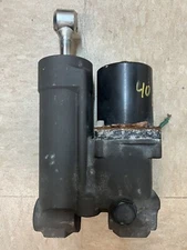 Used 40HP E-TEC Power Trim Unit, Part #5005441. Fits 40HP-60HP Engines.