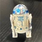 This is a vintage 1977 Kenner Star Wars R2-D2 action figure.