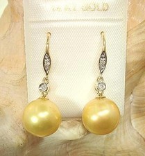 10.9mm Cultured FW Golden Pearl 0.04Cts Diamond 14k Yellow Gold Hook Earrings