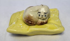 Collectible, puppy on a yellow cushion , salt/ pepper shaker