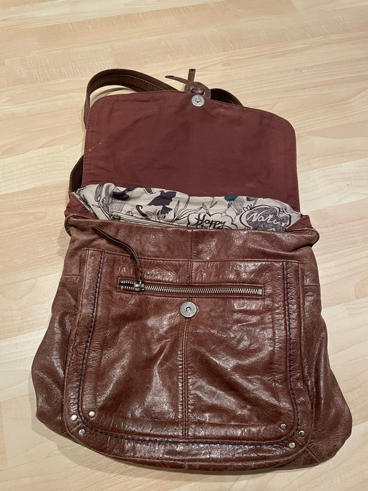 Borsa zaino a tracolla convertibile The Sak Ventura in pelle invecchiata marrone teak