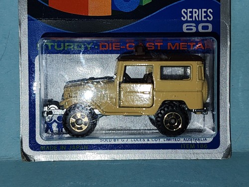 TOMICA TOYOTA LAND CRUISER en tarjeta azul HECHA PARA G.J COLES MELBOURNE AUSTRALIA - Imagen 9 de 9