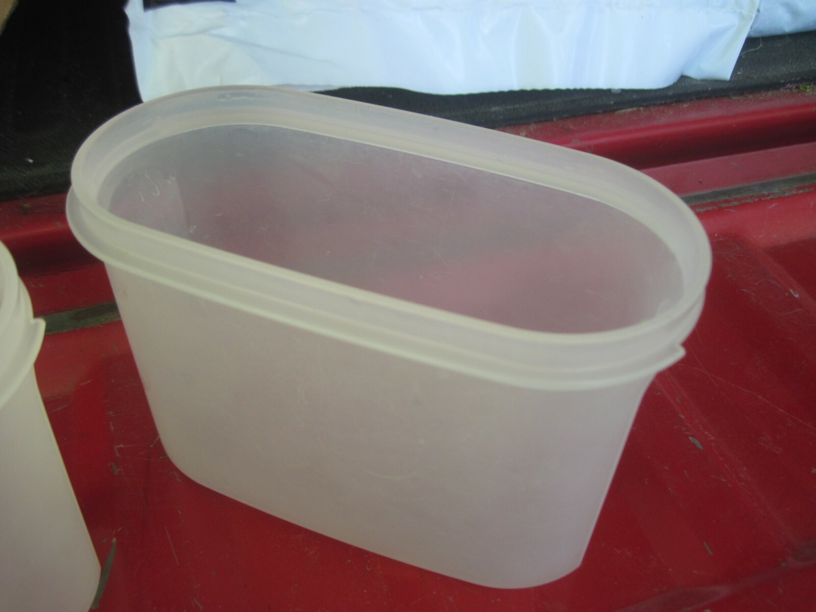 2 Oval Tupperware Storage Containers, 6 3/4" x 3 1/2" x almost 5" tall
