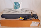LOGITECH BEIGE WIRELESS KEYBOARD AND MOUSE W/ EXTERNAL TRANSMITTER
