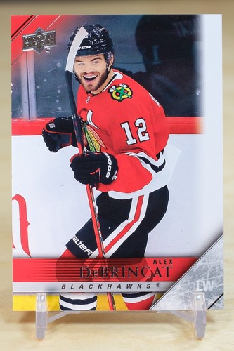 2020-21 Upper Deck 05-06 Tribute #T-17 Alex DeBrincat - Chicago Blackhawks