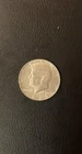 At melt  1969-P Kennedy Half Dollar 40% Silver BU/AU Slightly Toned