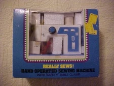 HAND OPERATED SEWING MACHINE, PRODUCT OF UNIVERSAL, "REALLY SEWS!" (1961