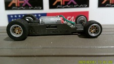 AFX RACING H.O. SCALE MEGA G 1.7 NARROW CHASSIS SILVER RIMS GOLD INSERT RED CAM