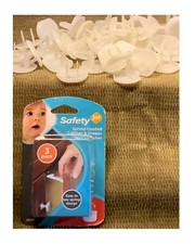 ONE UNOPENED SAFETY CABINET  DRAWER LATCHES PLUS 50 PIECES OF OUTLET COVERS