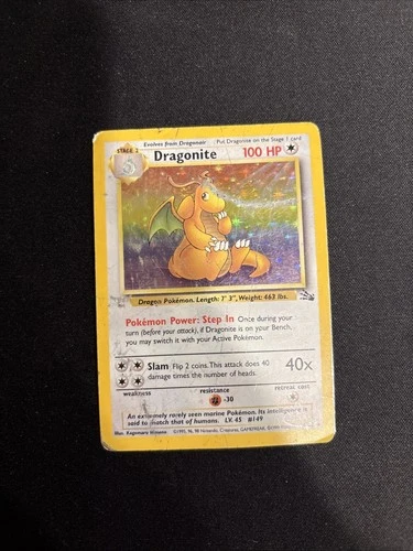 1999 Pokémon Fossil set Dragonite Holo Rare card, specifically card number 4/62.