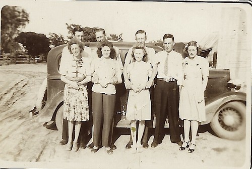 FOUR YOUNG COUPLES POSE IN FRONT OF AN AUTOMOBILE IN TEXAS HILL COUNTRY (1946) - Picture 2 of 3