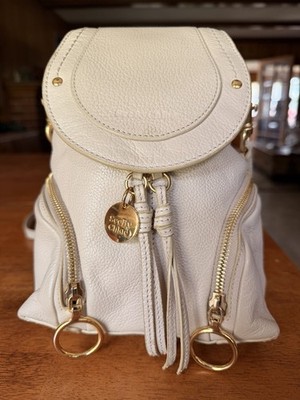 See By Chloe Mini Backpack Cream Pebbled Leather Gold Hardware Tassel Bag