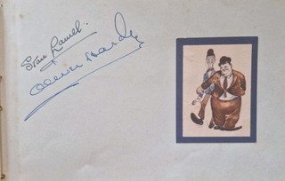 LAUREL AND HARDY. ORIGINAL SIGNED PAGE. IN PERSON AUTOGRAPH.