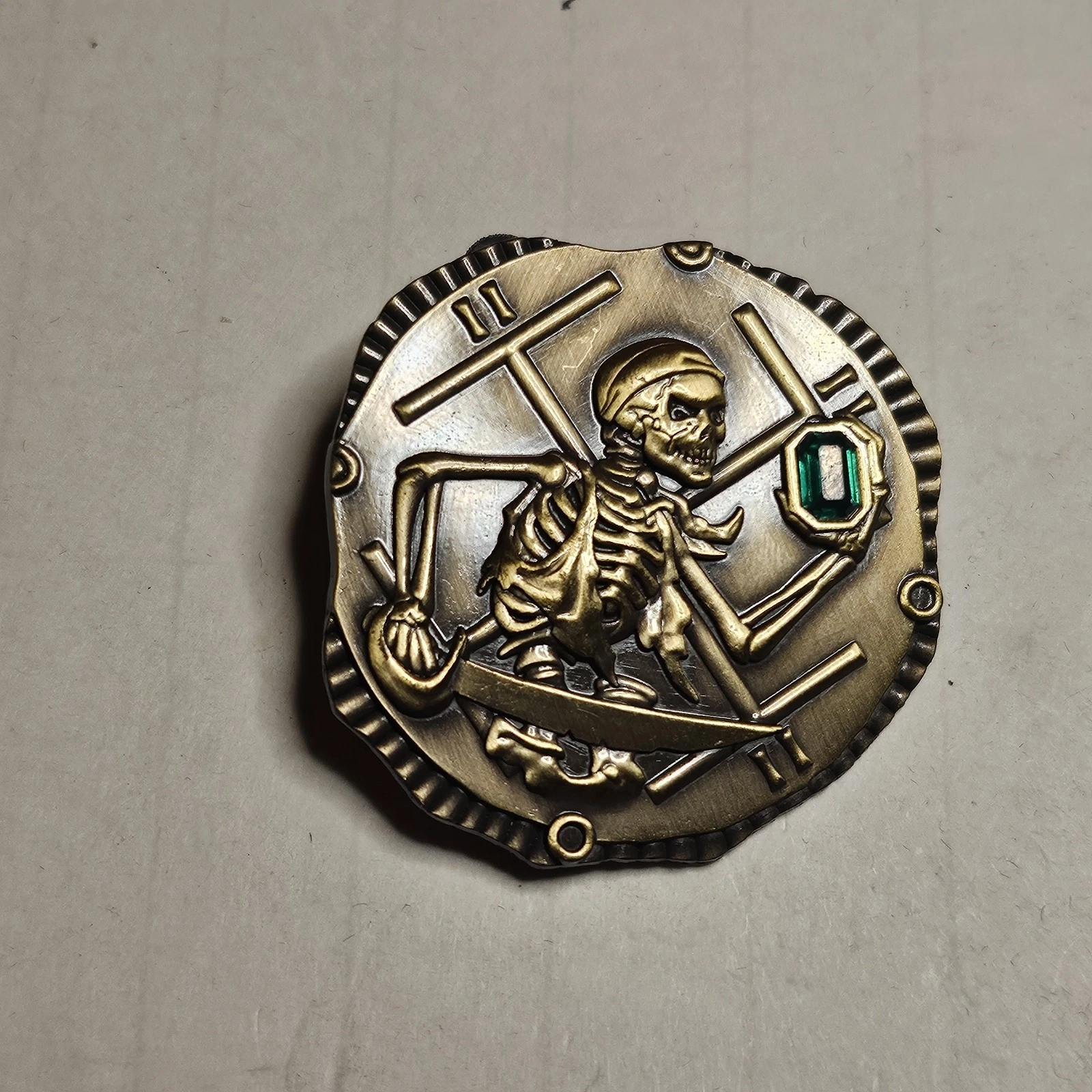Disney WDW Pirates of the Caribbean Skeleton Gold Coin Pin W/ Green Gem