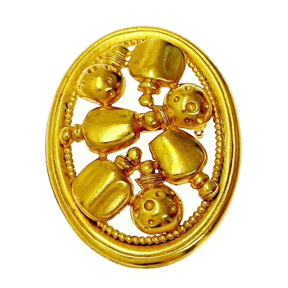 Broche dorée parfums Christian Dior 5,1 x 3,8 cm bijoux d'occasion