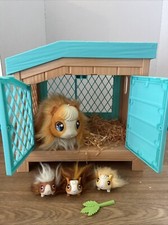 Little Live Pets - Mama Surprise Guinea Pig & 3 babies with Hutch & Surprises