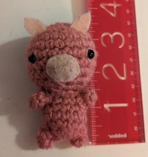 Pink amigurumi crocheted pig