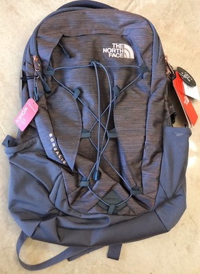 navy blue and rose gold north face backpack