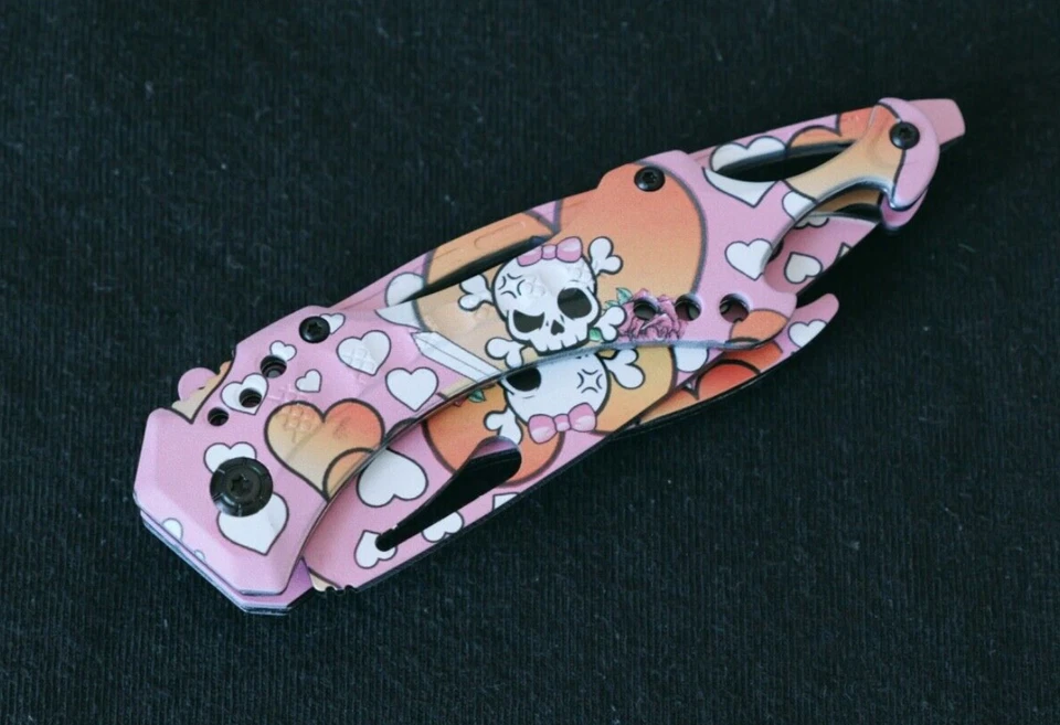 Linda navaja de bolsillo rosa manga calavera corazón ayuda resorte abridor de botellas Foto 2 de 4