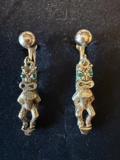 Vintage Pair of TIKI MAN earrings / green rhinestone eyes / 1.5" / screw back