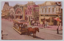 Postcard Disneyland Main Street Upjohn Drug Store and Horse drawn Carriage