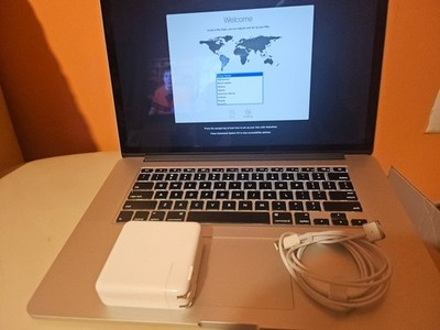 silver Macbook Pro Core i7 8GB 256 GB laptop ideal for home office use. In